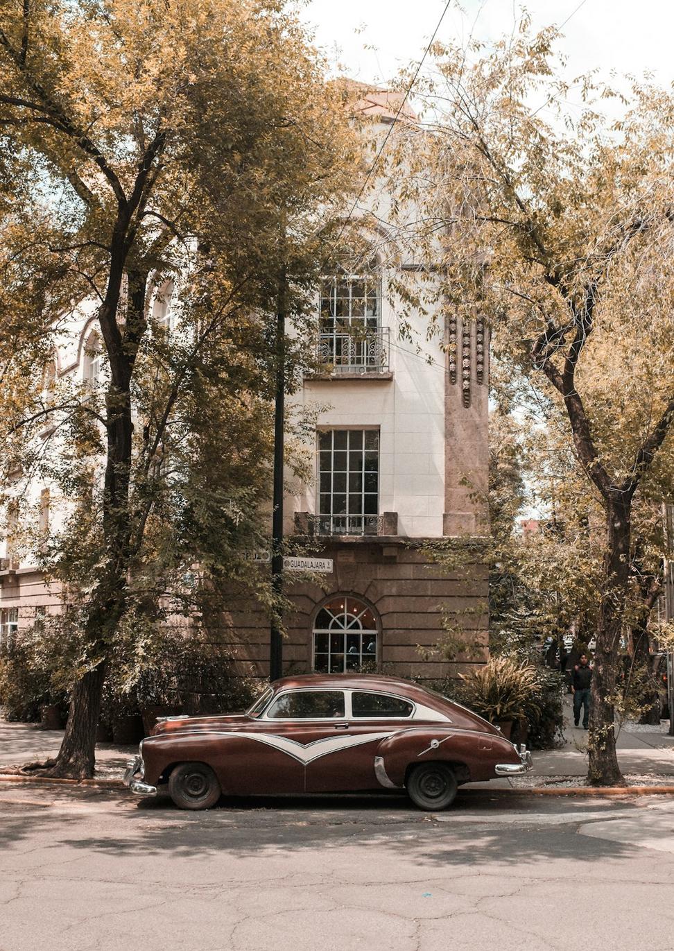 Hotel exterior with vintage cars